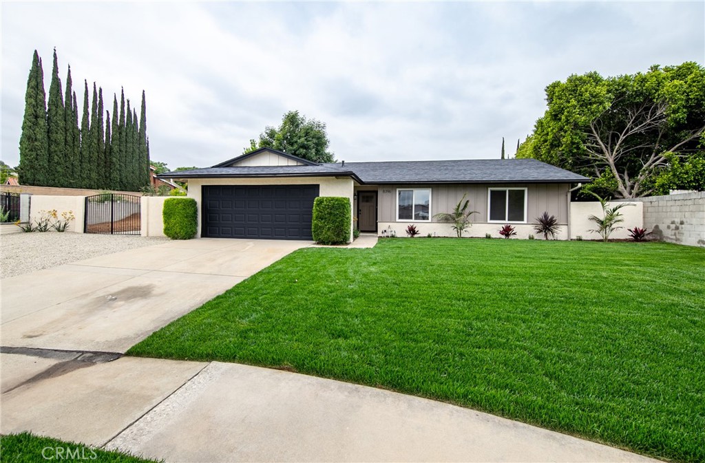8396 Holly Street Rancho Cucamonga, CA 91701 - Photo 1 of 1 a front view of house with yard