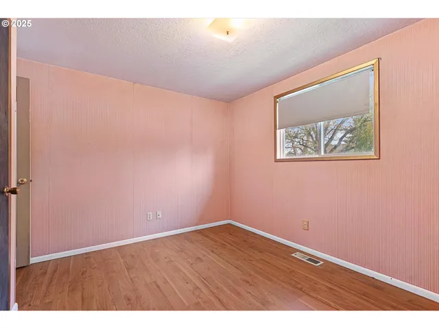 a bathroom with a sink a mirror and a shower