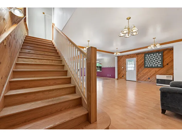 a kitchen with stainless steel appliances kitchen island granite countertop a refrigerator and microwave