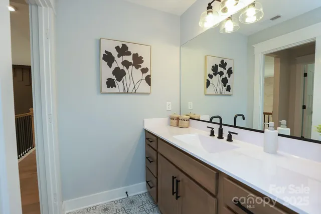 a bathroom with a glass shower door