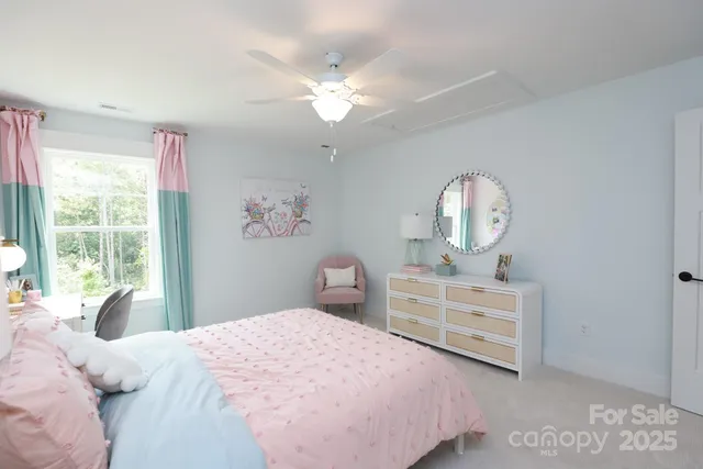 a backyard of a house with lots of green space and plants