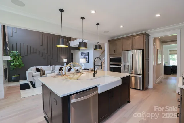 a kitchen with a refrigerator a sink and dishwasher