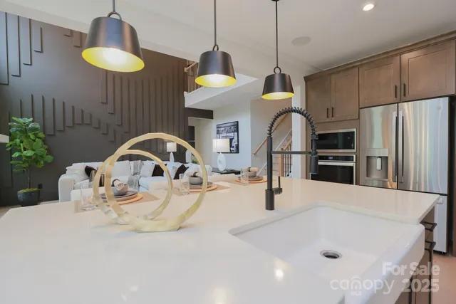 a kitchen with a refrigerator and a sink