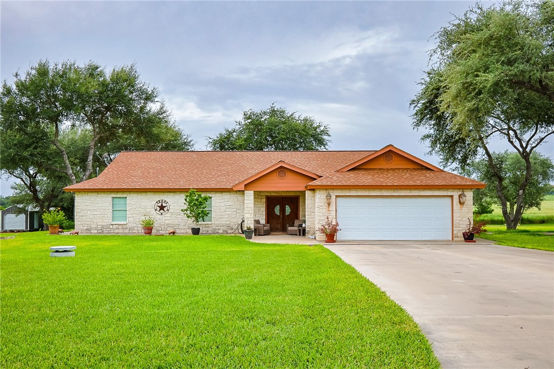 2697 Oak Grove Road Beeville, TX 78102 - Photo 1 of 1 a front view of house with yard and green space