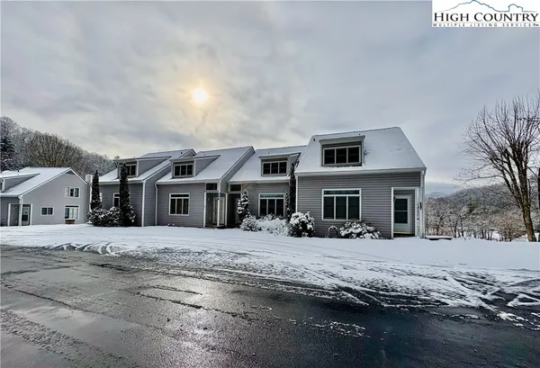 a front view of a house with yard