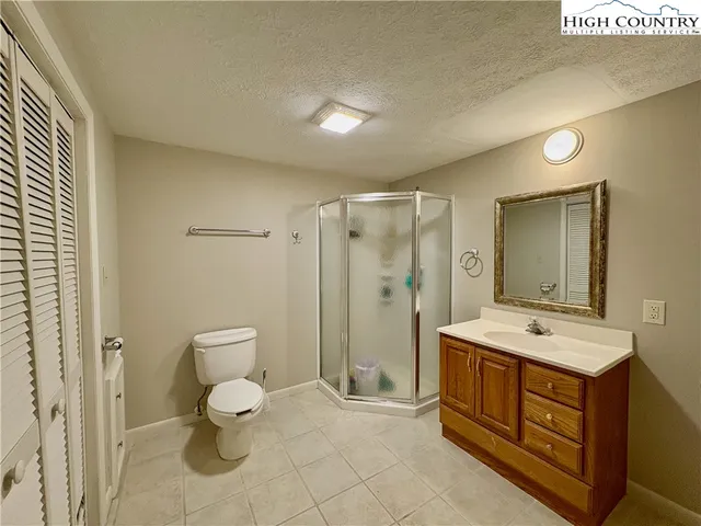 a spacious bathroom with a sink toilet and shower