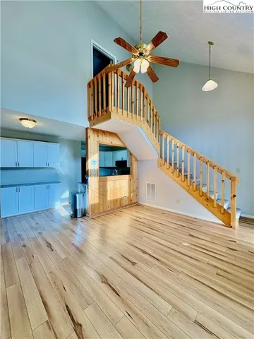 a view of an entryway with wooden floor