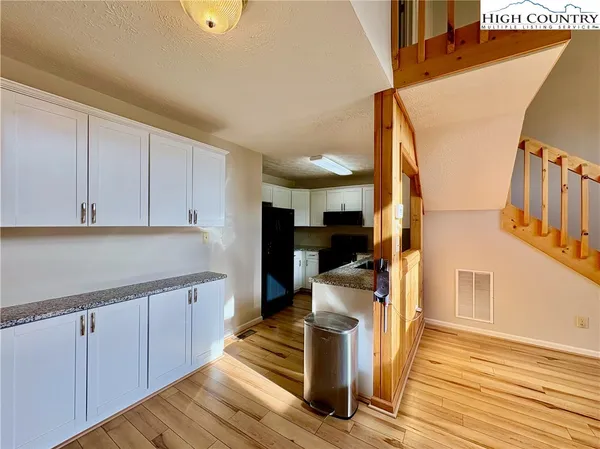 a view of kitchen with wooden floor