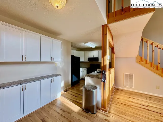 a view of kitchen with wooden floor