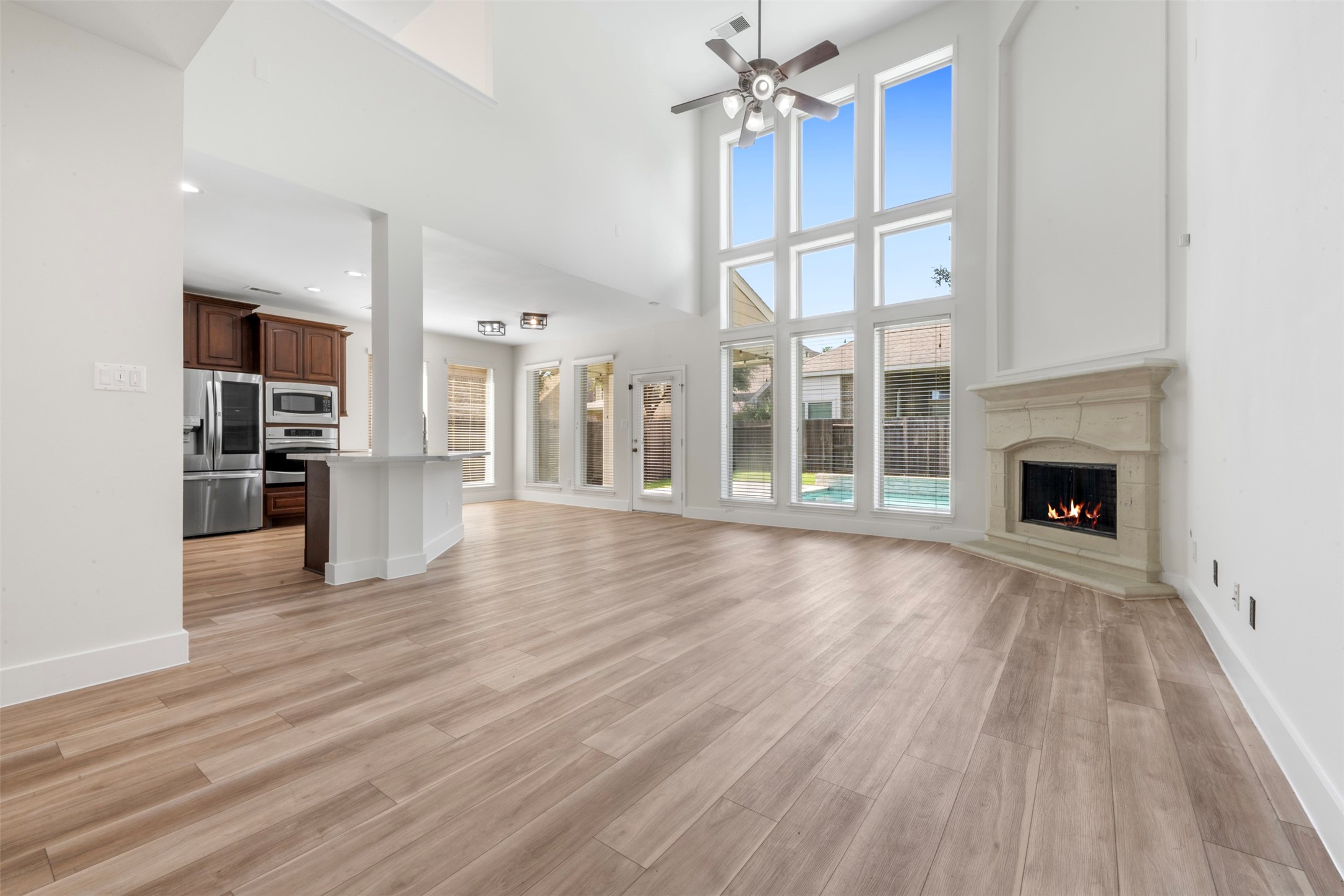 26422 Red Cliff Ridge Katy, TX 77494 - Photo 7 of 40 Super high ceiling in this 2 story family room. Perry Homes famous 'wall of windows' gives you a great view of the pool and entertaining space out back!