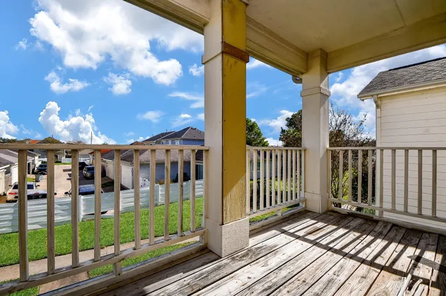 a view of a balcony with a potted plant
