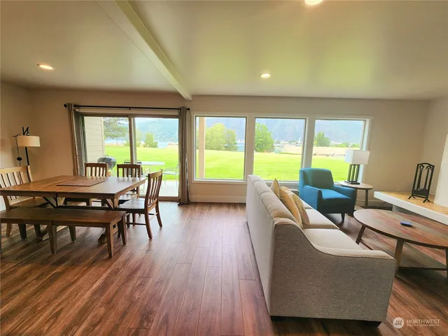 a view of a dining room with furniture window and wooden floor