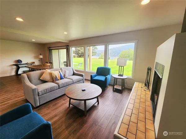 a living room with furniture and a large window