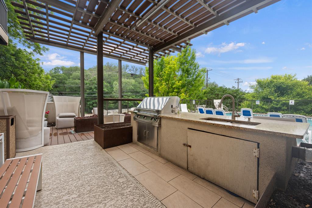 1900 Barton Springs Road, Unit 4041 Austin, TX 78704 - Photo 33 of 35 a view of a patio with a table and chairs