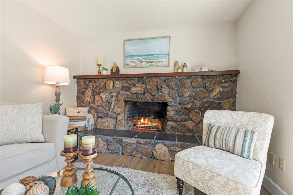 1300 Amesti Road Watsonville, CA 95076 - Photo 13 of 34 a living room with furniture and a fireplace