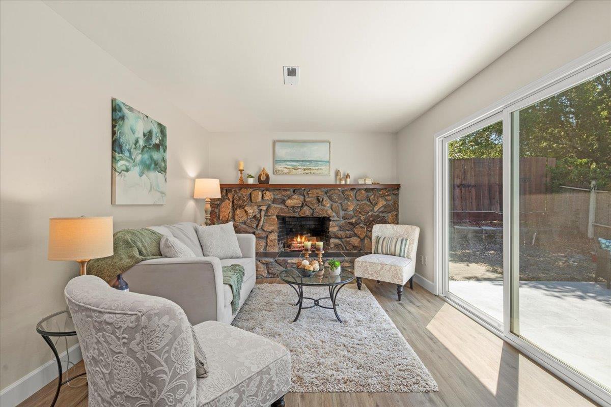 1300 Amesti Road Watsonville, CA 95076 - Photo 14 of 34 a living room with furniture a large window and a fireplace