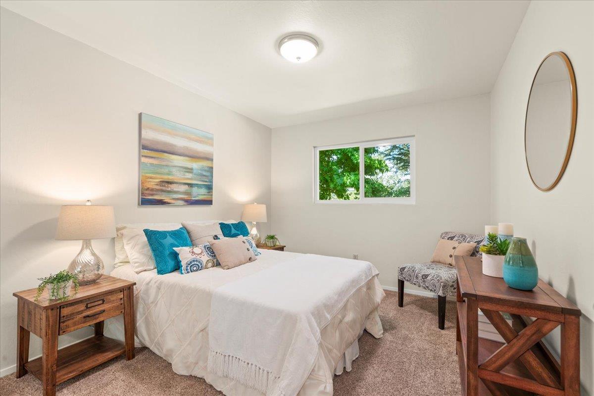 1300 Amesti Road Watsonville, CA 95076 - Photo 22 of 34 a bedroom with a bed a window and potted plant