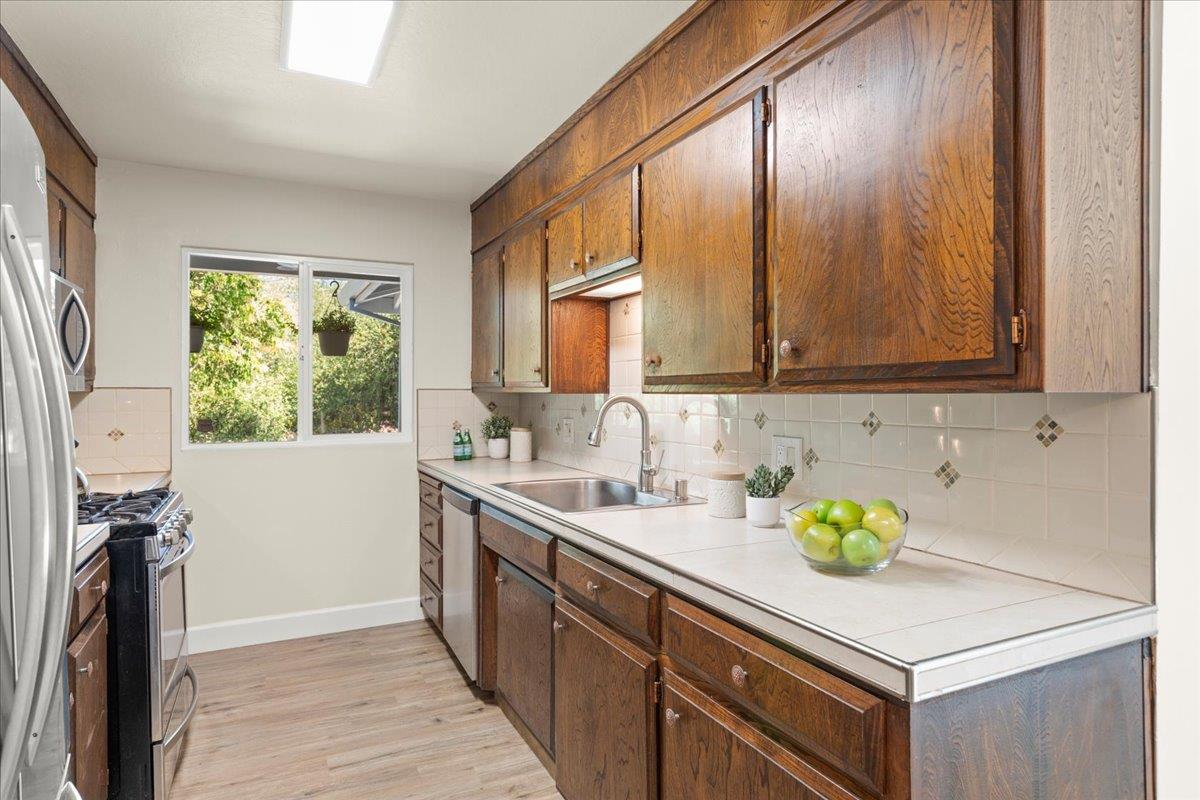 1300 Amesti Road Watsonville, CA 95076 - Photo 7 of 34 a kitchen with a sink cabinets and window