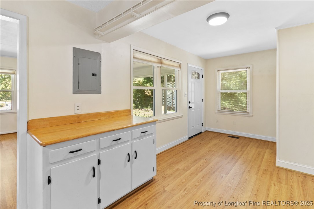 1512 Crescent Drive Spring Lake, NC 28390 - Photo 13 of 36 a view of an empty room with wooden floor and a window