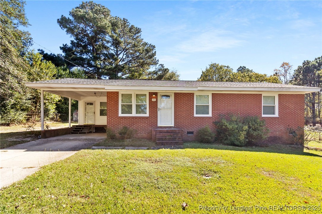 1512 Crescent Drive Spring Lake, NC 28390 - Photo 2 of 36 front view of a house with a yard