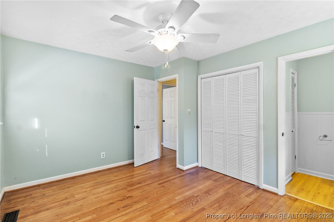 1512 Crescent Drive Spring Lake, NC 28390 - Photo 21 of 36 wooden floor in an empty room with a window