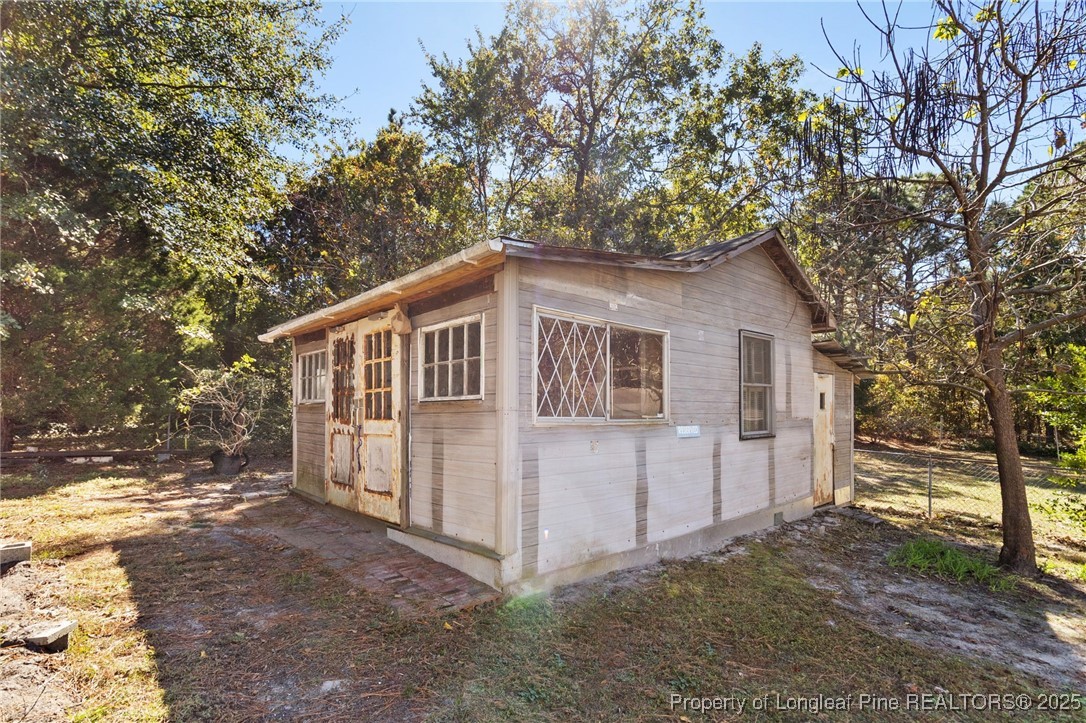 1512 Crescent Drive Spring Lake, NC 28390 - Photo 36 of 36 a white house that has tree in front of it