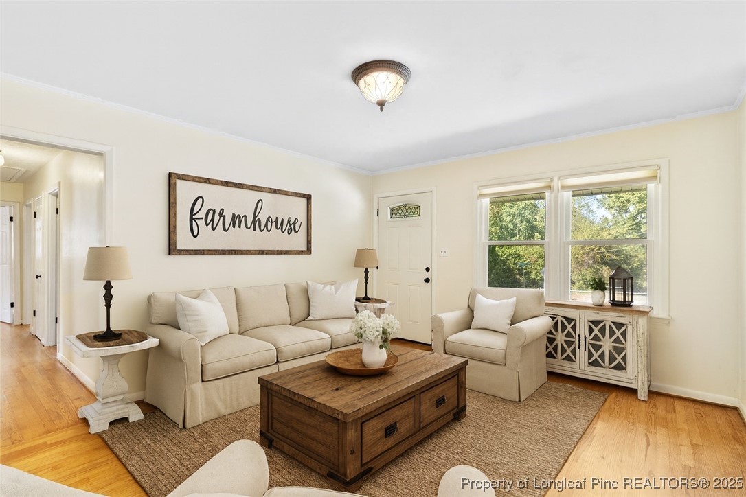 1512 Crescent Drive Spring Lake, NC 28390 - Photo 9 of 36 a living room with furniture and a large window