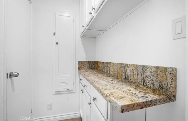 a view of utility room and empty racks