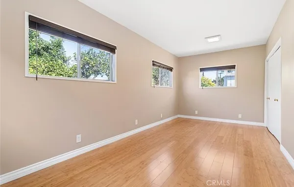 a view of room with wooden floor and window