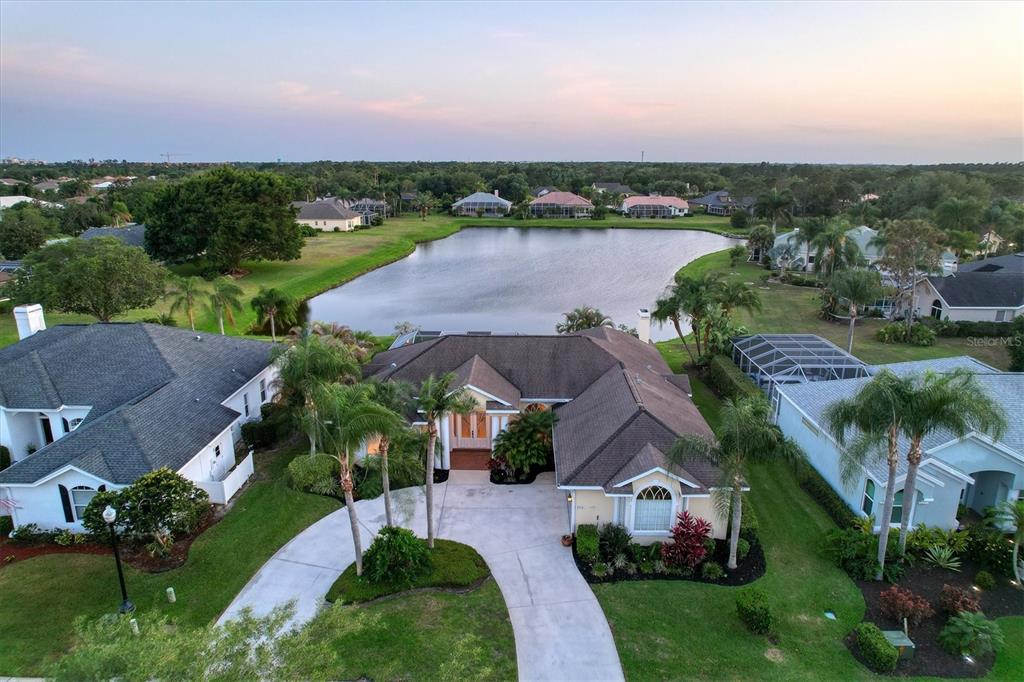 9910 Laurel Valley Ave Circle Bradenton, FL 34202 - Photo 2 of 37 an aerial view of house with yard and lake view in back