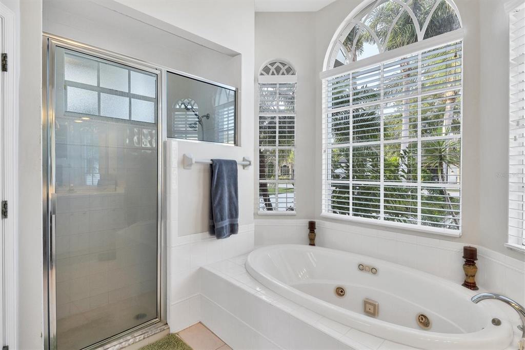 9910 Laurel Valley Ave Circle Bradenton, FL 34202 - Photo 24 of 37 a bathroom with a bathtub and a shower