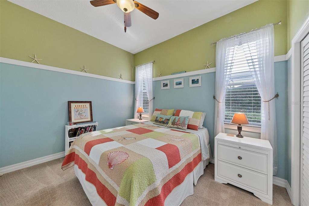 9910 Laurel Valley Ave Circle Bradenton, FL 34202 - Photo 26 of 37 a bedroom with a bed and a dresser
