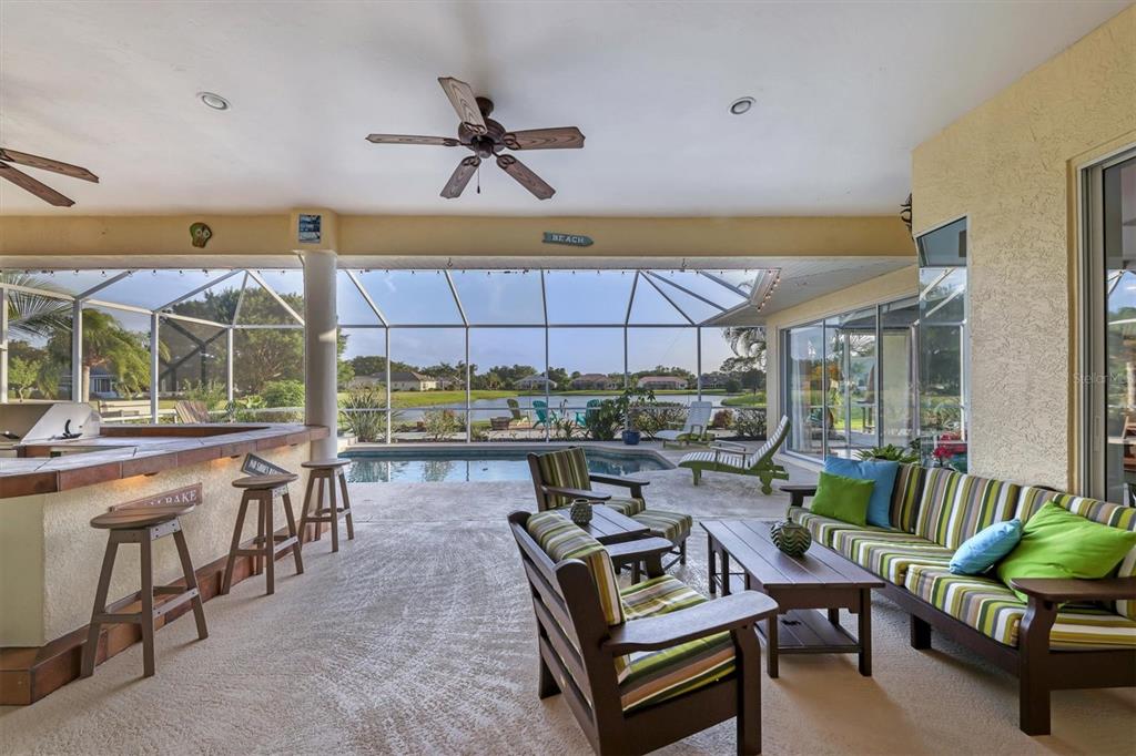 9910 Laurel Valley Ave Circle Bradenton, FL 34202 - Photo 31 of 37 a living room with a couch and a table