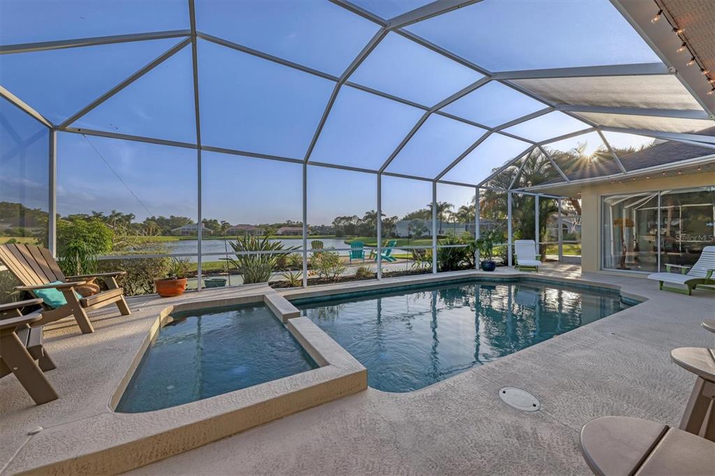9910 Laurel Valley Ave Circle Bradenton, FL 34202 - Photo 32 of 37 a view of a swimming pool with outdoor seating