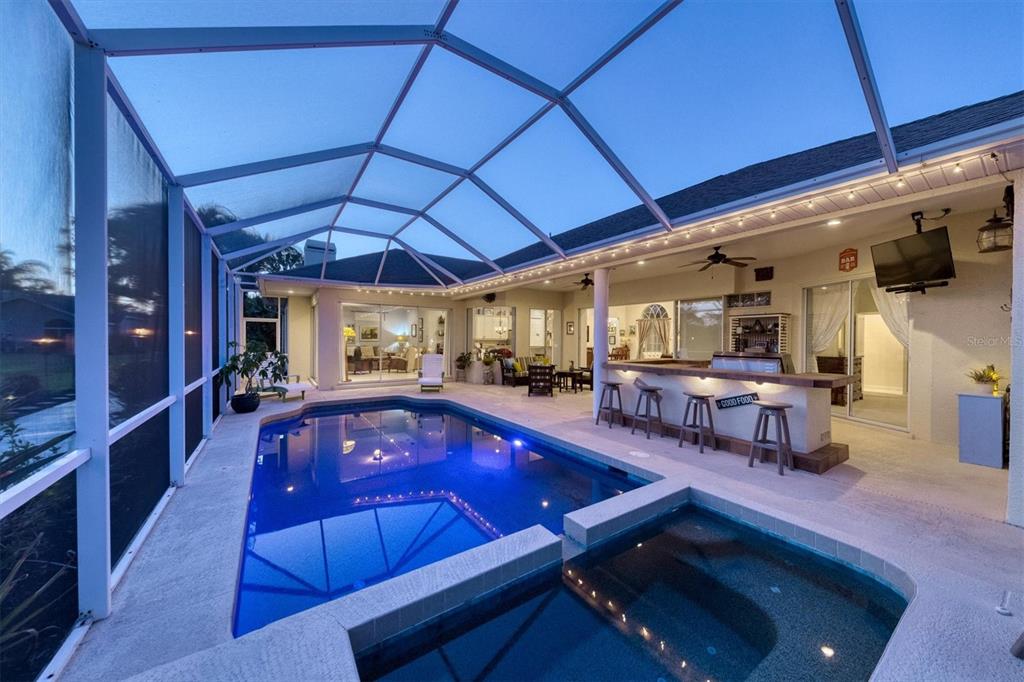 9910 Laurel Valley Ave Circle Bradenton, FL 34202 - Photo 8 of 37 a swimming pool with outdoor seating