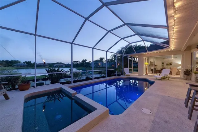 a view of a swimming pool with a patio