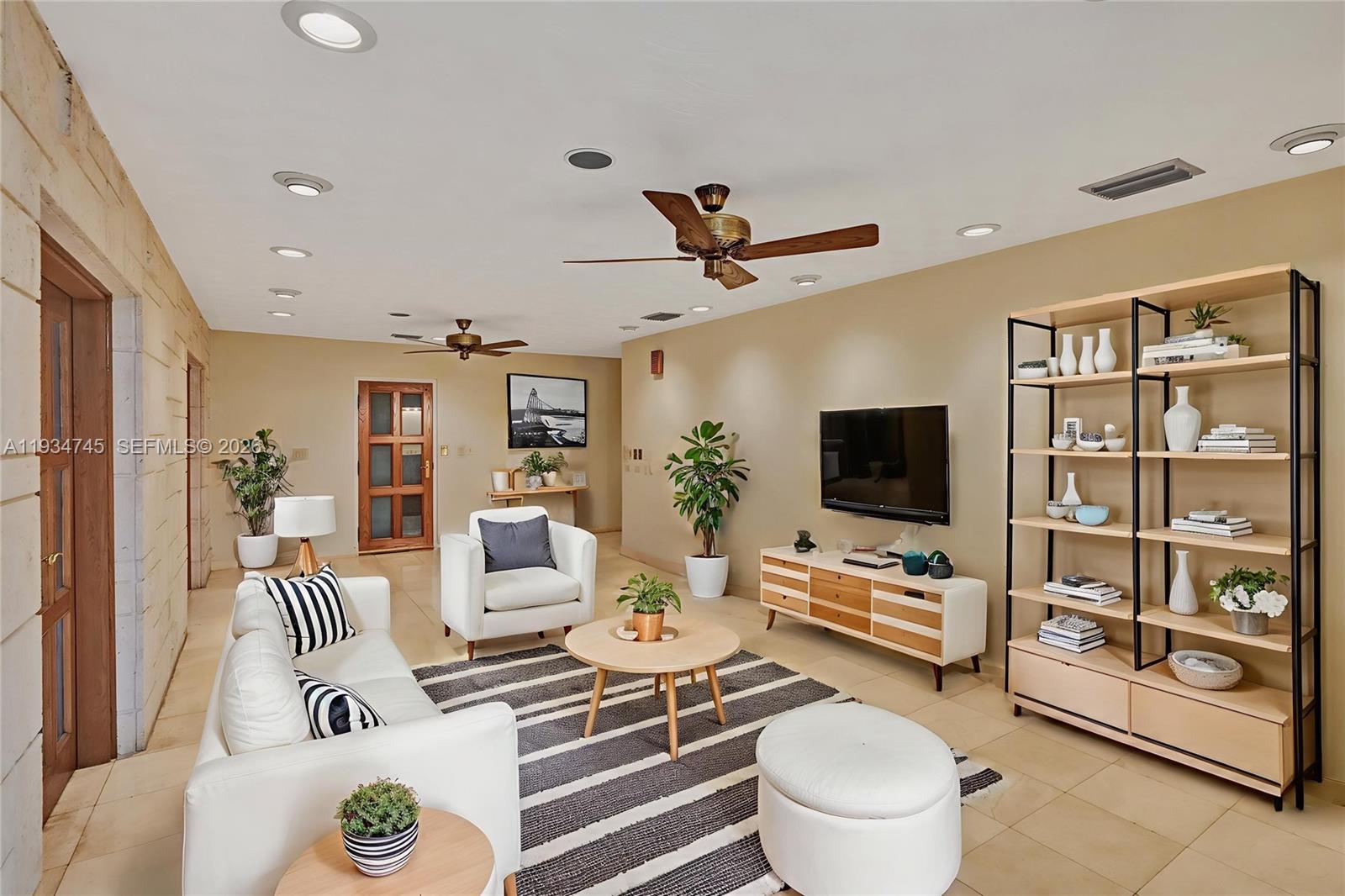 366 West 12th Street Hialeah, FL 33010 - Photo 1 of 99 a living room with furniture and a flat screen tv