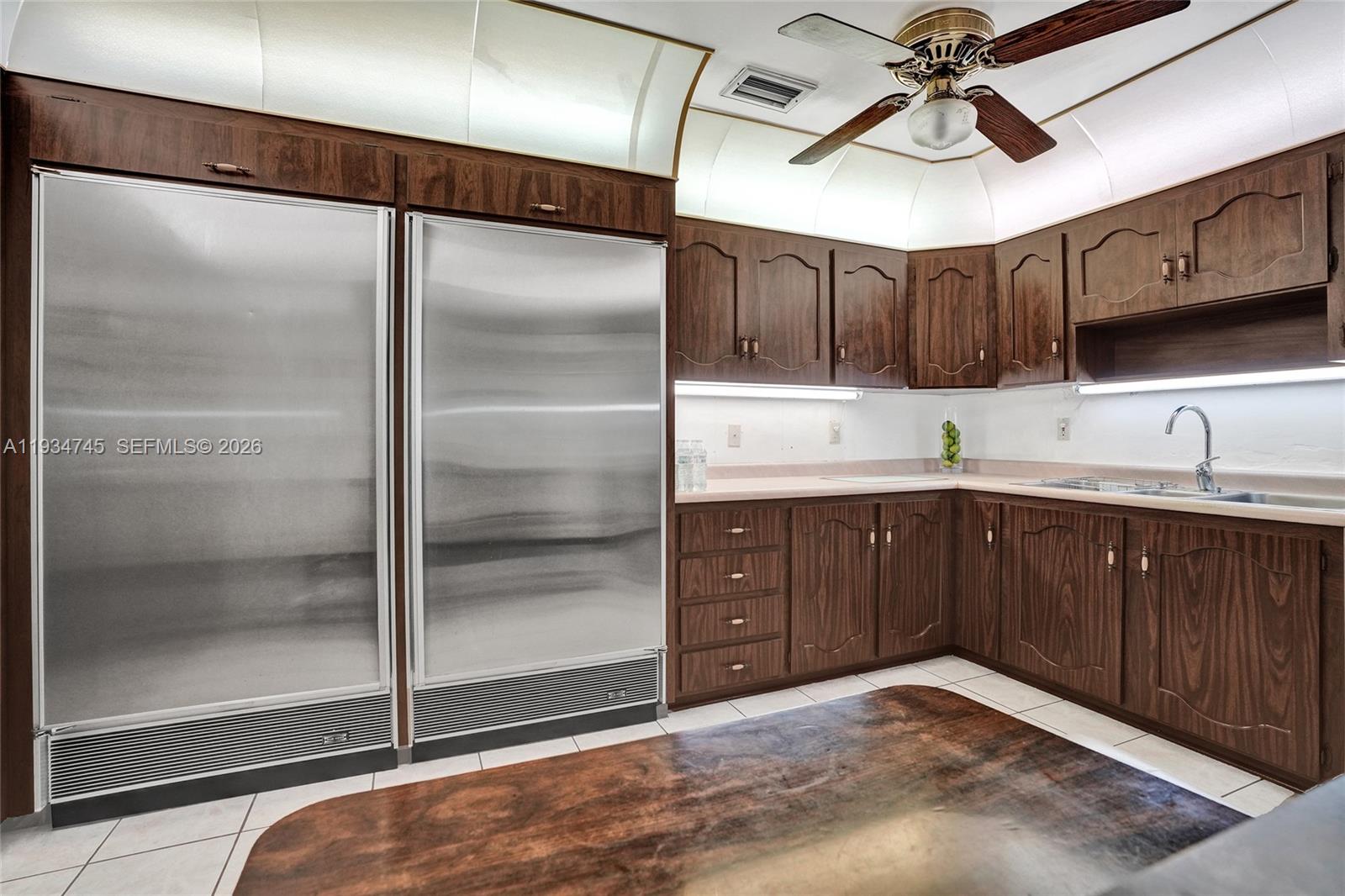 366 West 12th Street Hialeah, FL 33010 - Photo 61 of 99 a kitchen with a refrigerator and a sink