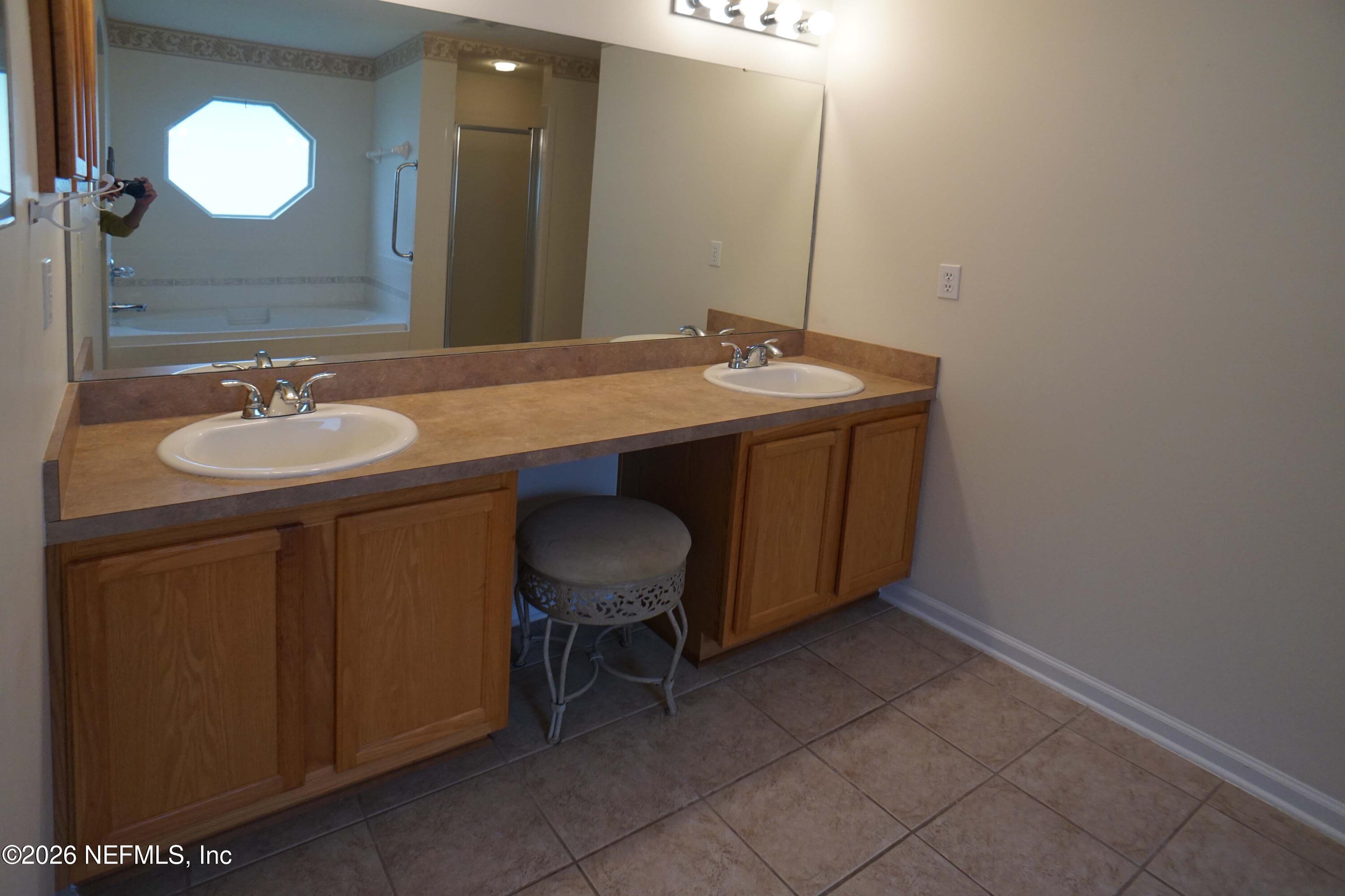 1721 Keswick Road St. Augustine, FL 32084 - Photo 11 of 17 a bathroom with a sink and a mirror