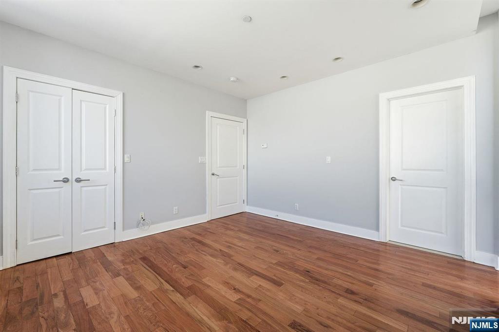 8125 River Road, Unit 4E North Bergen, NJ 07047 - Photo 13 of 35 a view of an empty room with wooden floor