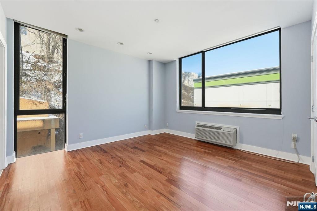 8125 River Road, Unit 4E North Bergen, NJ 07047 - Photo 15 of 35 a bedroom with a bed and a window