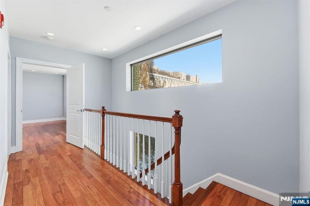 8125 River Road, Unit 4E North Bergen, NJ 07047 - Photo 17 of 35 a view of a hallway with wooden floor