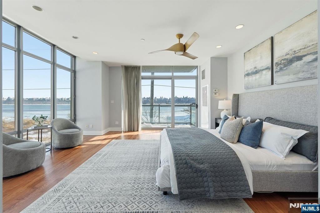 8125 River Road, Unit 4E North Bergen, NJ 07047 - Photo 18 of 35 a bedroom with a large bed and a large window