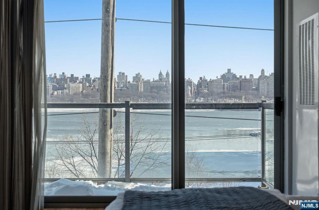 8125 River Road, Unit 4E North Bergen, NJ 07047 - Photo 21 of 35 a view of a glass door with a tree in the background
