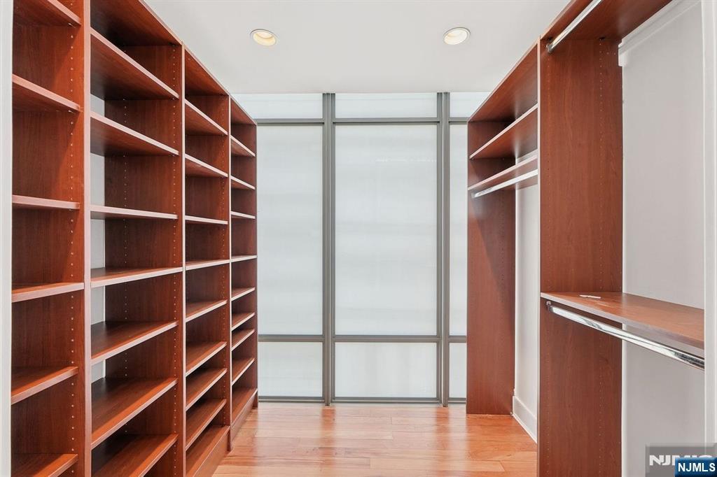 8125 River Road, Unit 4E North Bergen, NJ 07047 - Photo 26 of 35 a view of walk in closet with empty racks