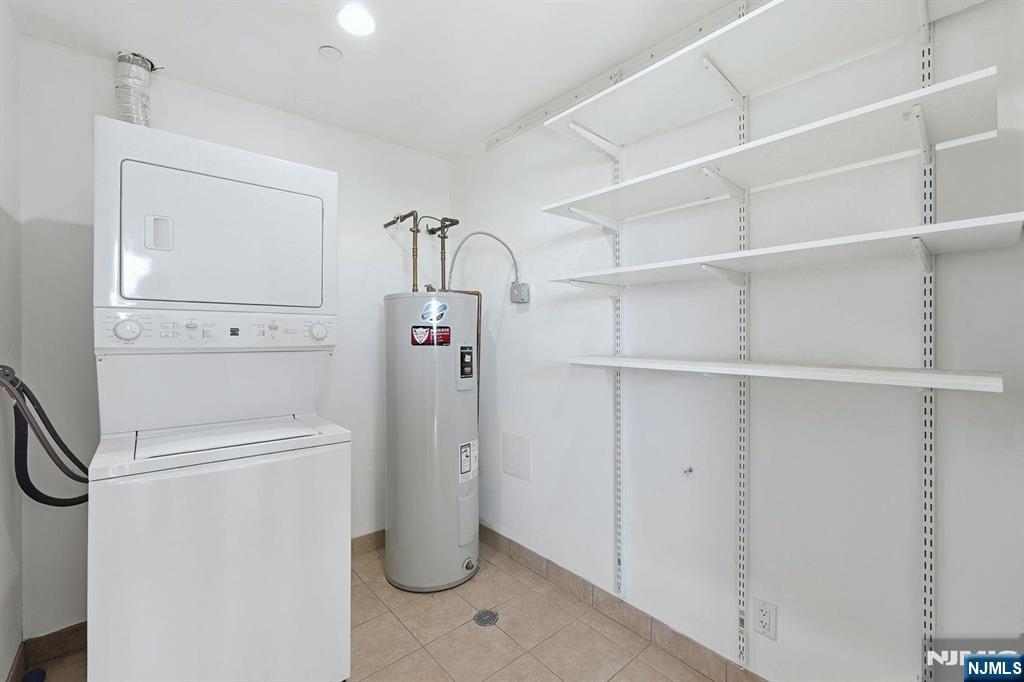 8125 River Road, Unit 4E North Bergen, NJ 07047 - Photo 29 of 35 a view of a storage & utility room with washer and dryer