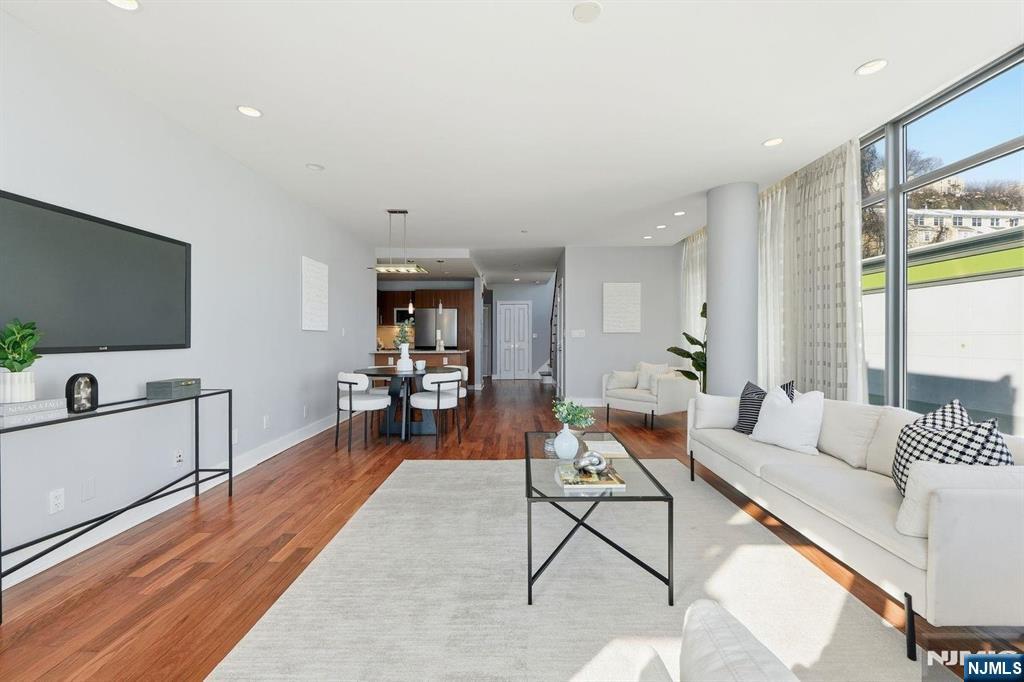 8125 River Road, Unit 4E North Bergen, NJ 07047 - Photo 7 of 35 a living room with furniture and a flat screen tv