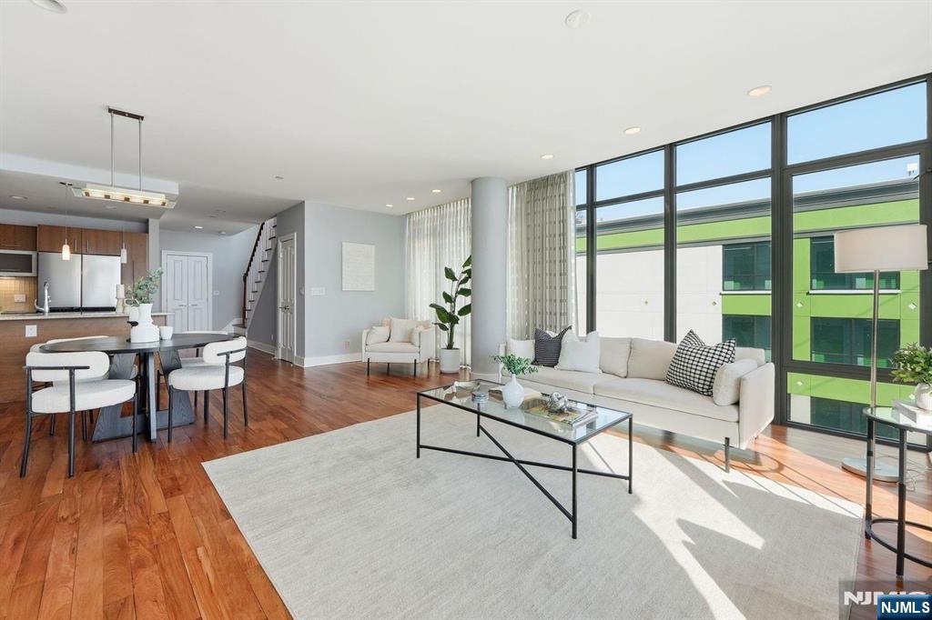 8125 River Road, Unit 4E North Bergen, NJ 07047 - Photo 8 of 35 a living room with furniture and a large window