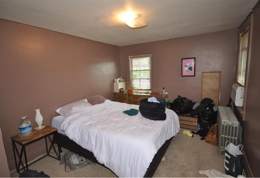 626-628 Pittsburgh Street Springdale, PA 15144 - Photo 23 of 34 a bedroom with a bed and a flat tv screen on the dresser