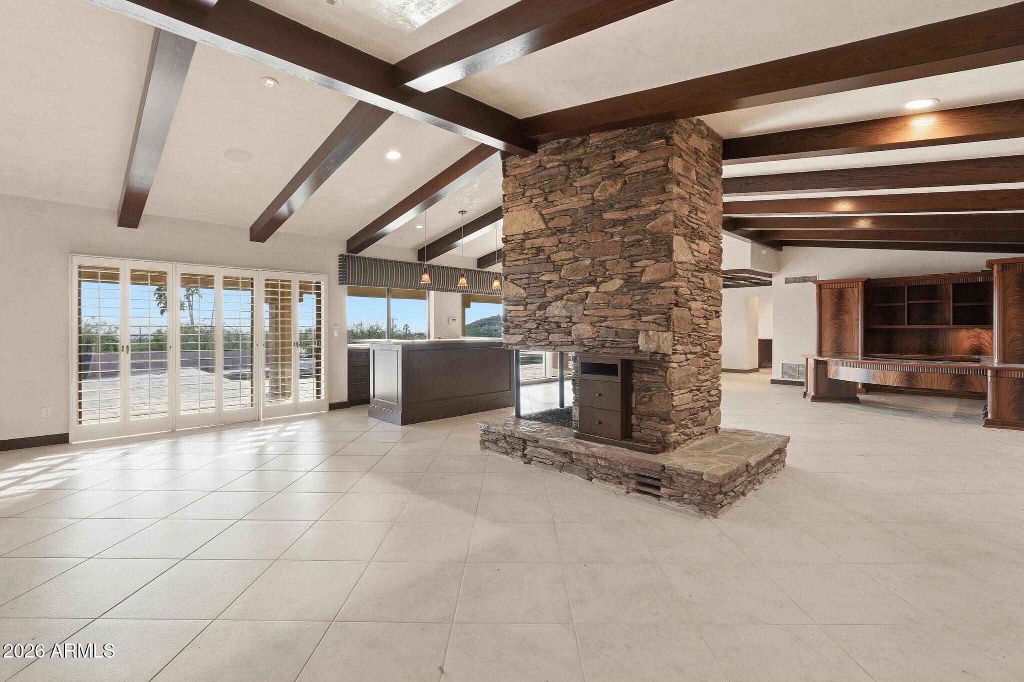 4021 East Lamar Road Paradise Valley, AZ 85253 - Photo 14 of 48 a living room with furniture and a fireplace